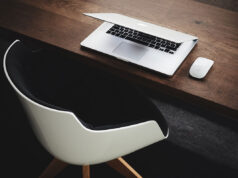 The hand rail is going a little faster than the moving sidewalk.